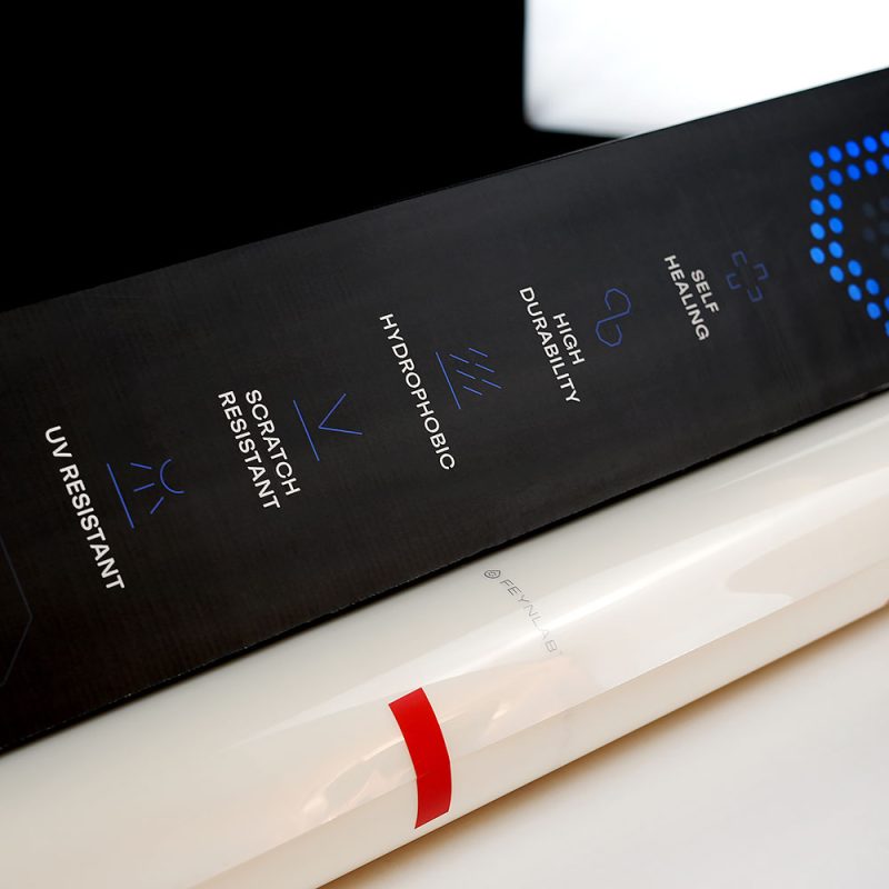 Close-up of Feynlab PPF Flex box with feature icons and clear film roll ready for professional installation