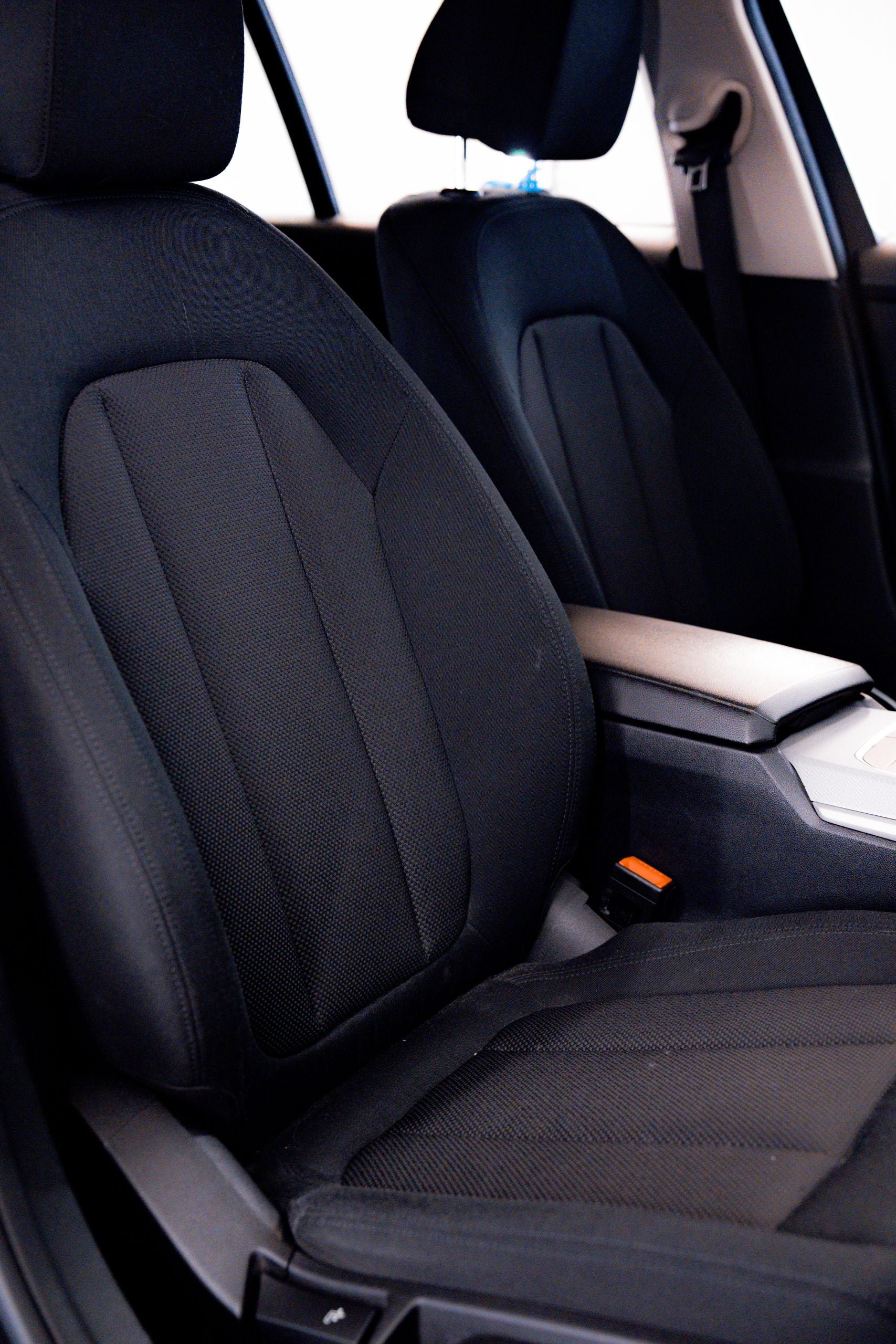 Labocosmetica TEXIA ready-to-use cleaner sprayed onto car seat fabric