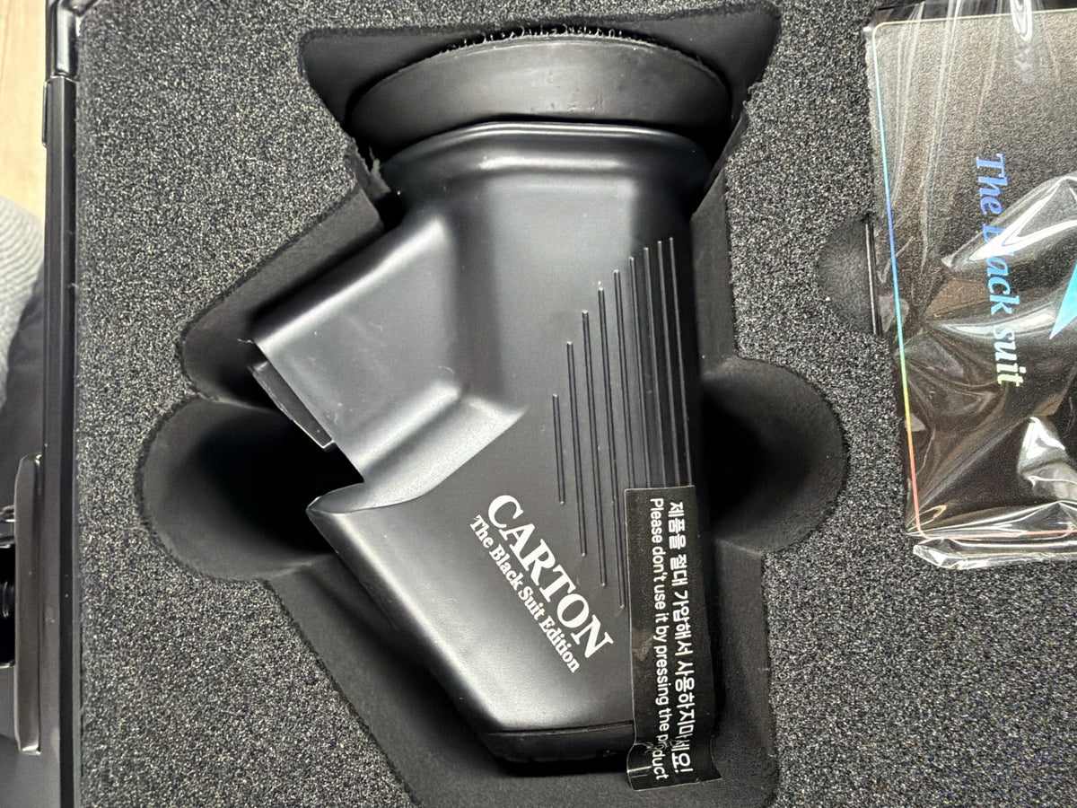 Carton Black Suit Edition glass oil-film removing polisher head with its pad, in the foam case
