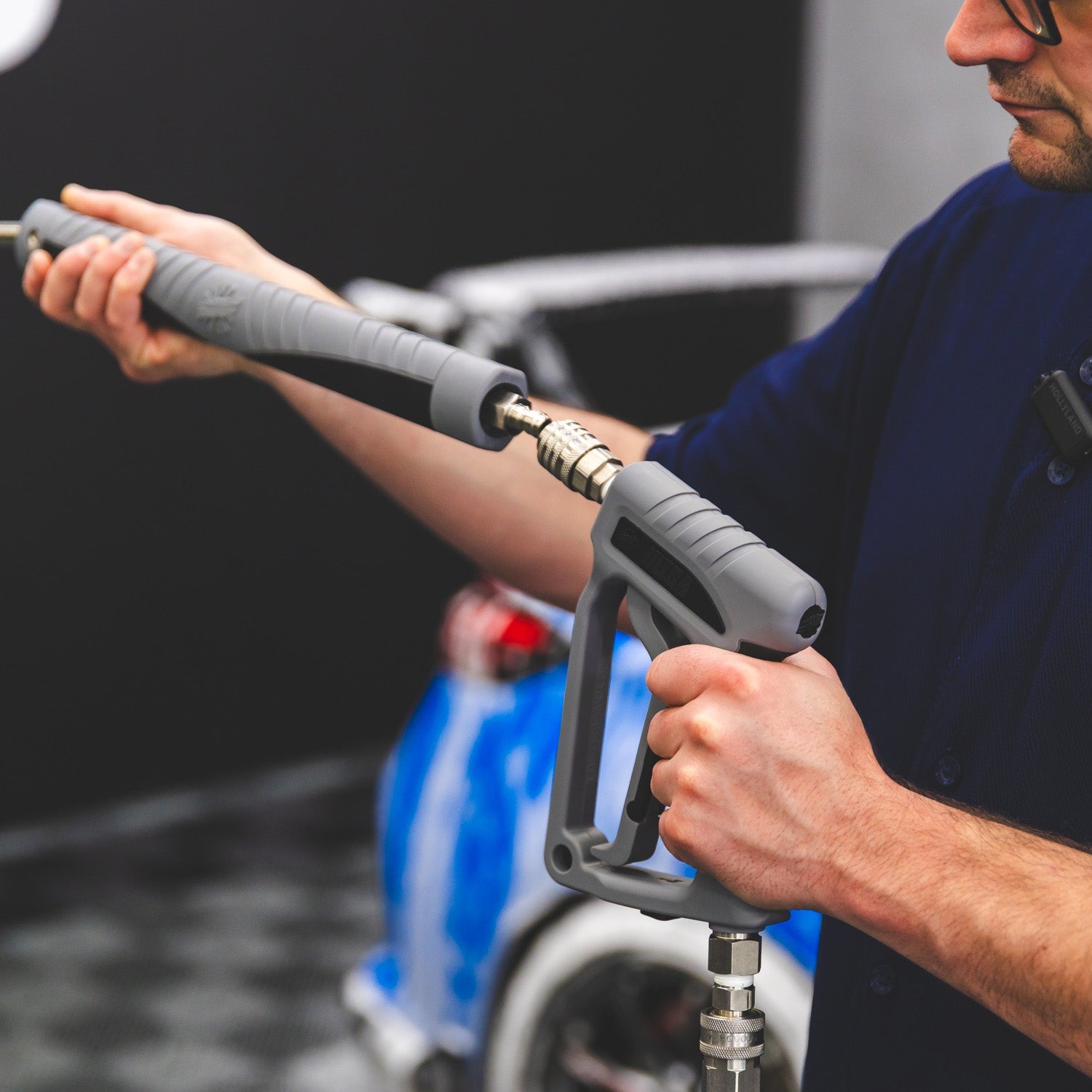 Ultra H2O Spray Wand in use rinsing a car during a maintenance wash