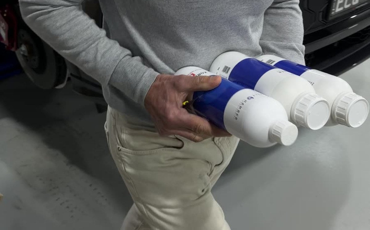 Paolo carrying an armful of Bilt Hamber products at the Alpha Details studio in Heidelberg West, Melbourne