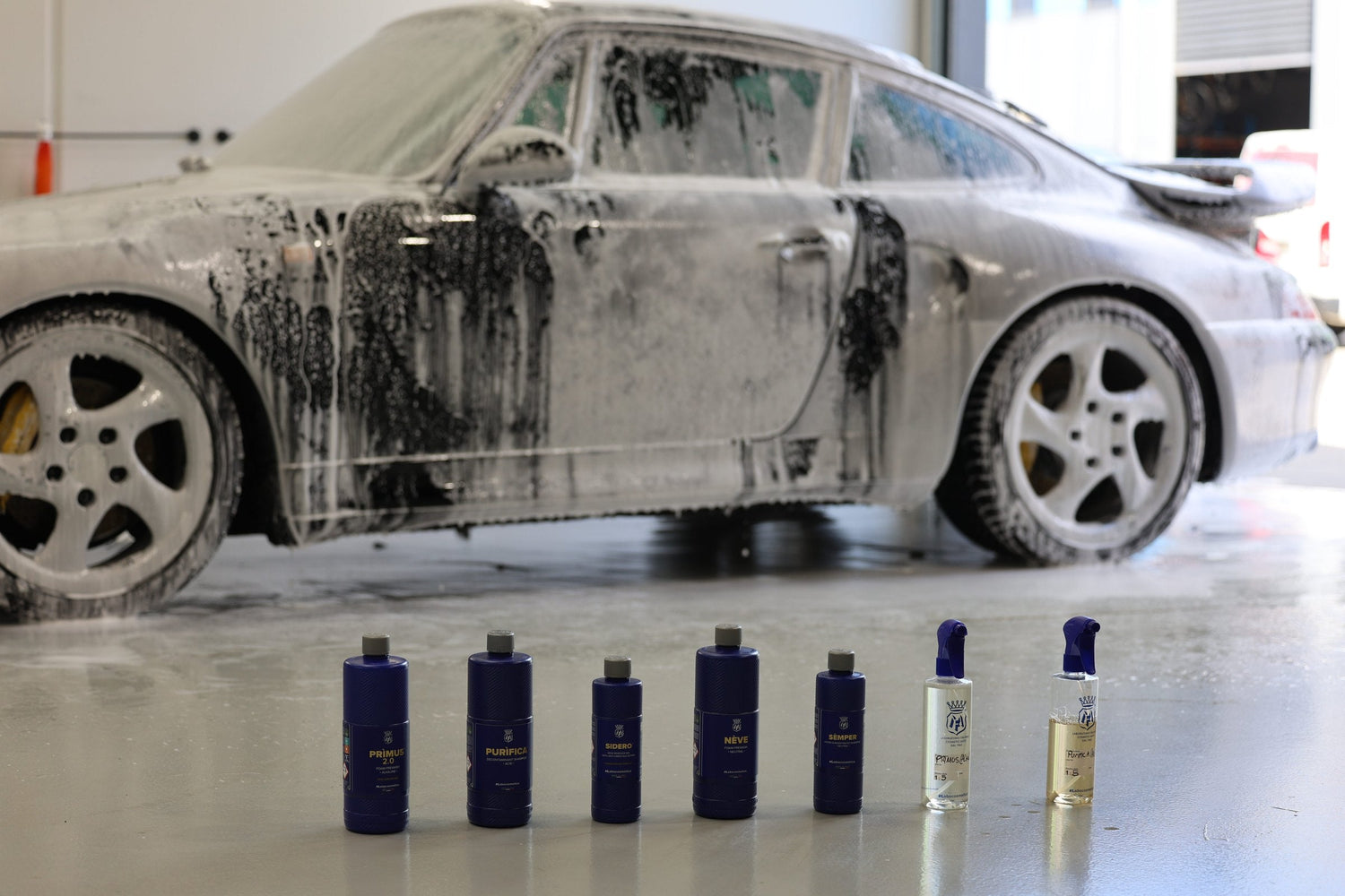 Foamed Porsche 911 mid pre-wash at Alpha Details Melbourne with the Labocosmetica lineup and labelled dilution bottles