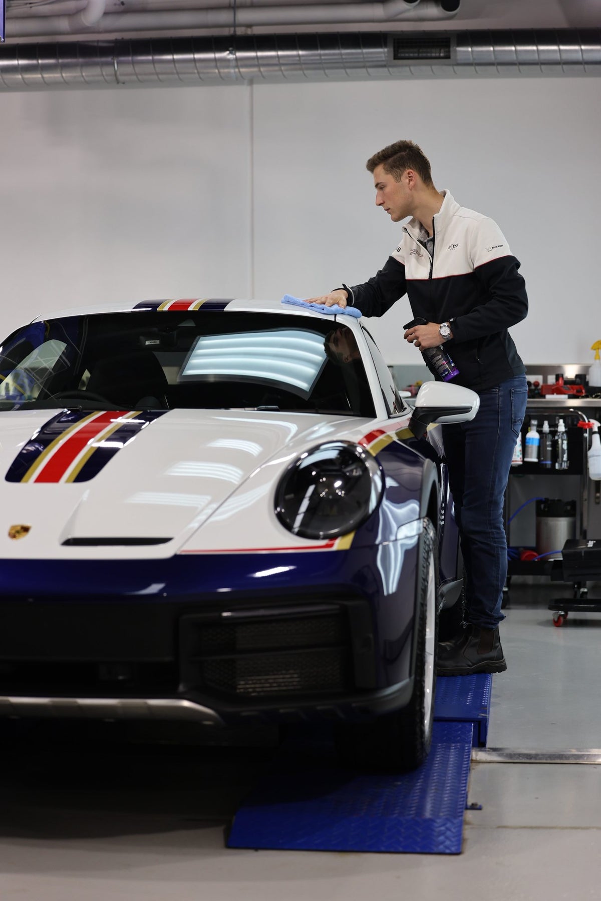 Car raised on the hoist for underbody work at Alpha Details