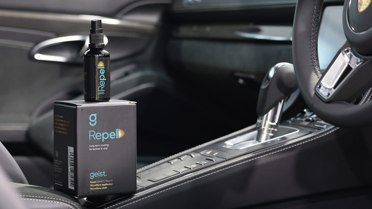 Geist Repel leather and vinyl coating bottle and box on the centre console of a Porsche interior — Alpha Details